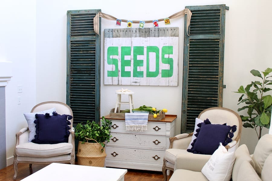 A garden themed family room with green and blue decor for summer.