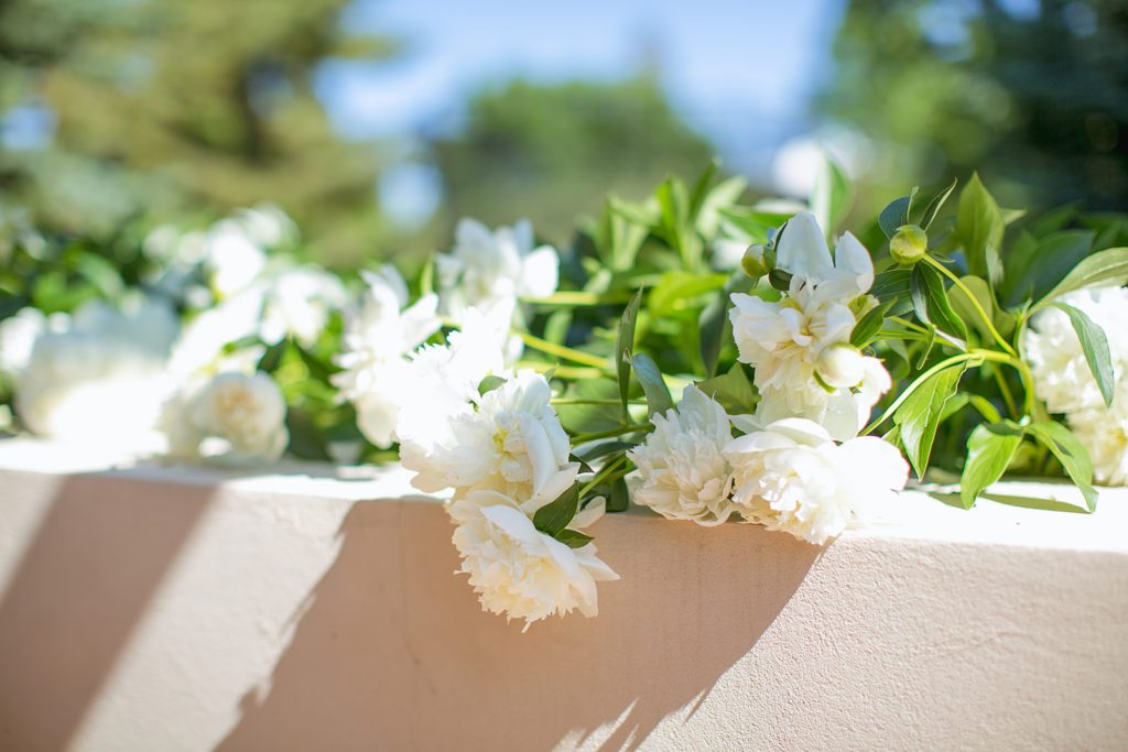 white peonies jsut beyond our outdoor table