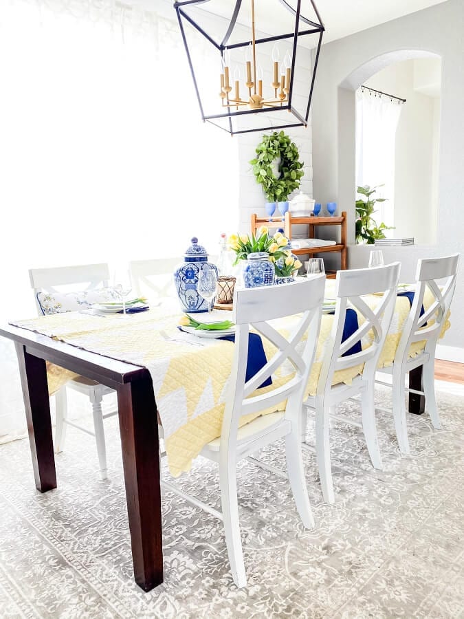 A Mother's Day tablescape complimented by tulips, ginger jars and vintage quilts.