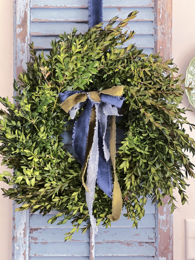 Boxwood wreath with velvet bow for Christmas