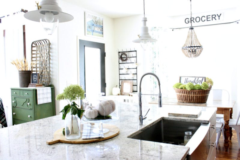 A view from the kitchen sink...fall decor in neutrals and greens.