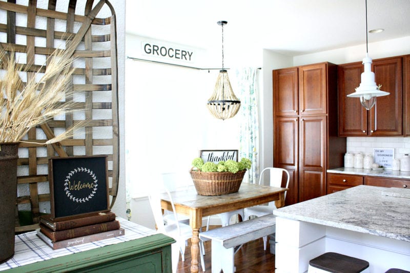 Signs, baskets and dried flowers are perfect fall decor.