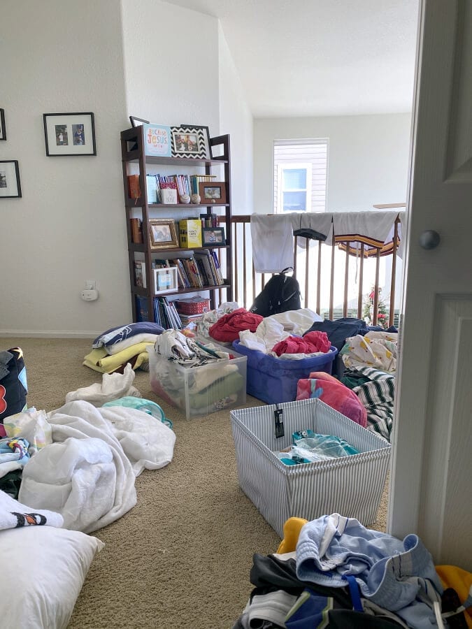 Sorting your closet contents into 3 groups: donate, trash, and keep piles makes the organizing process so easy!