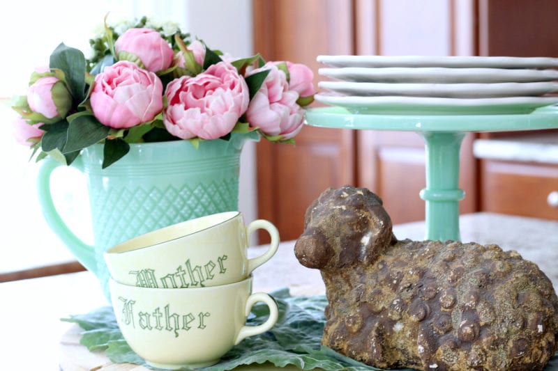 Touches of jadeite and pink make this a colorful Spring cottage kitchen.