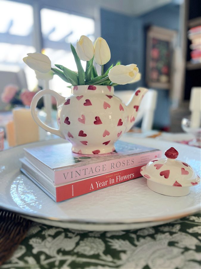 Faux white tulips in a tea pot