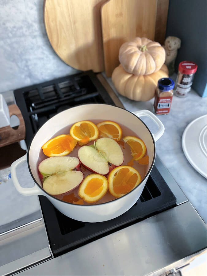 apples and orange in simmer pot