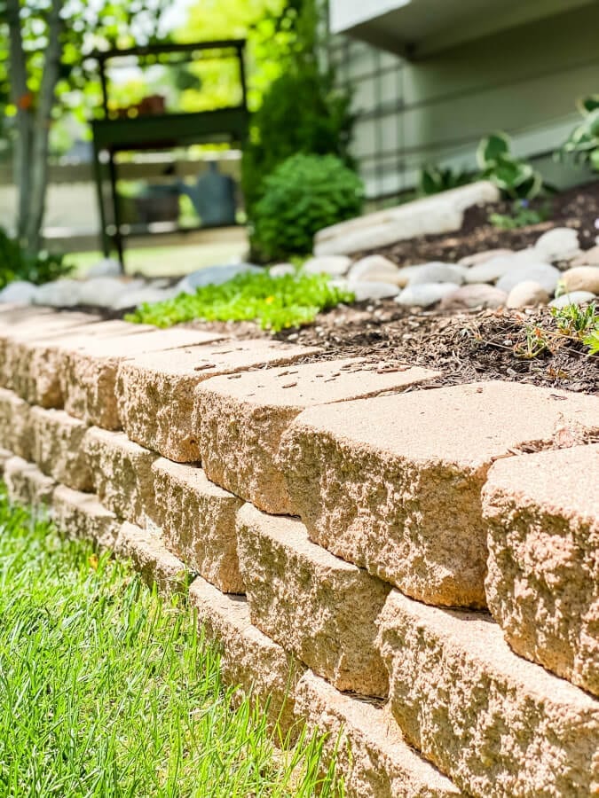 A retaining wall is a backyard DIY project perfect for any level of landscaper.