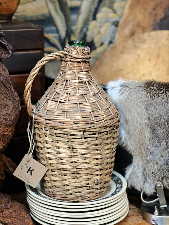 Wicker Demijohn in antiques booth