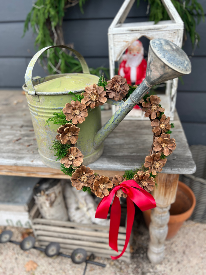 DIY Pinecone Flower Wreath on watering can