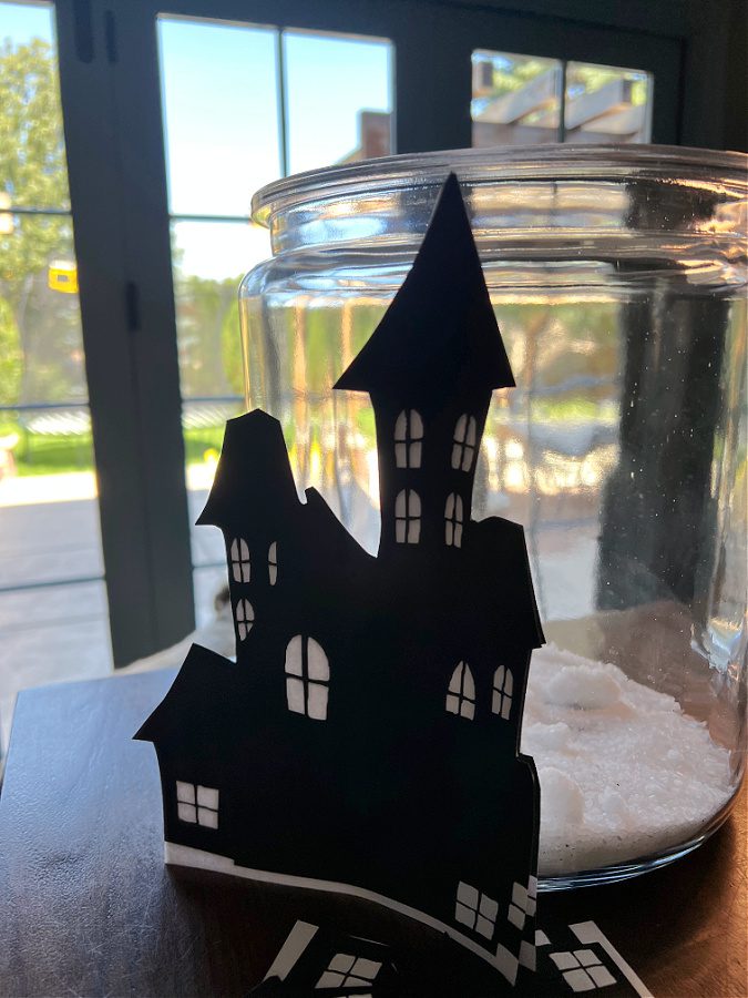 Trying out the houses on the jar