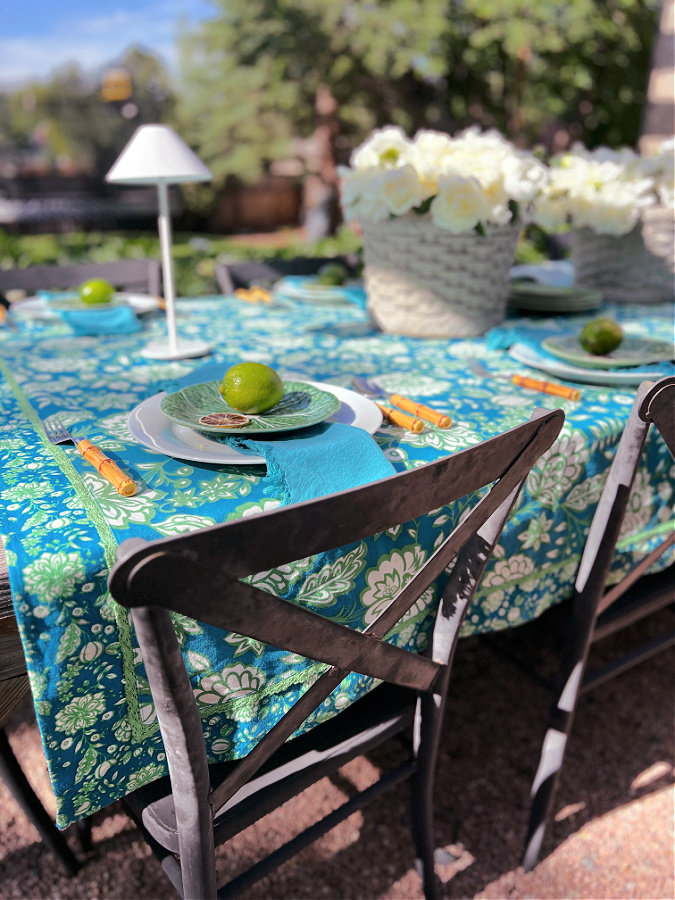 Elegant outdoor tropical tablescape with white peonies