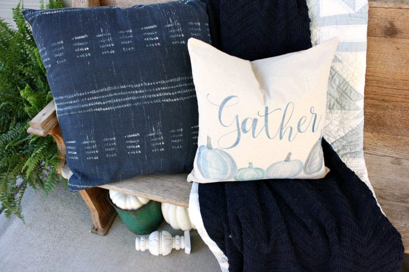 Gorgeous blue pillows on our porch pew for Fall.