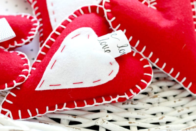 red felt heart pillow with love note in pocket