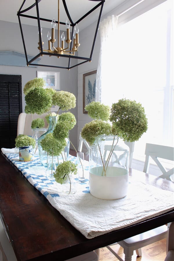 Check out this gorgeous flea market style Spring centerpiece featuring dried hydrangeas.