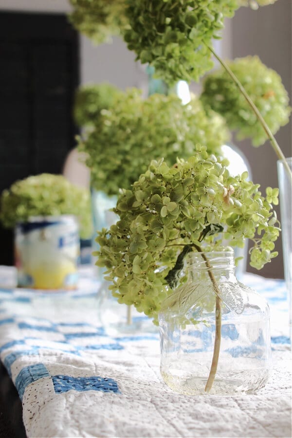 Upcycled apple juice jars become Spring vases