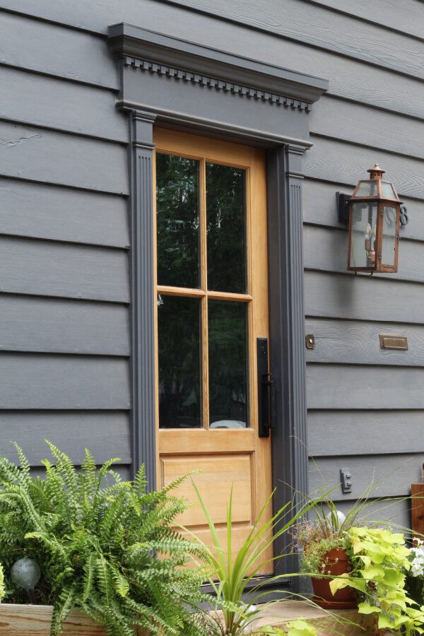 Our wood front door stole my heart. I love how beautifully it contrasts agasint the SW Peppercorn paint color of the house!