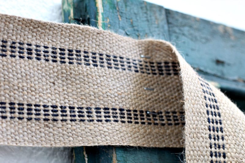 Attaching the jute webbing using a staple gun helped secure it to the shutter.