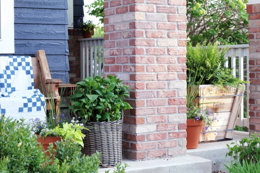 Give me all the potted flowers...summer porch love!