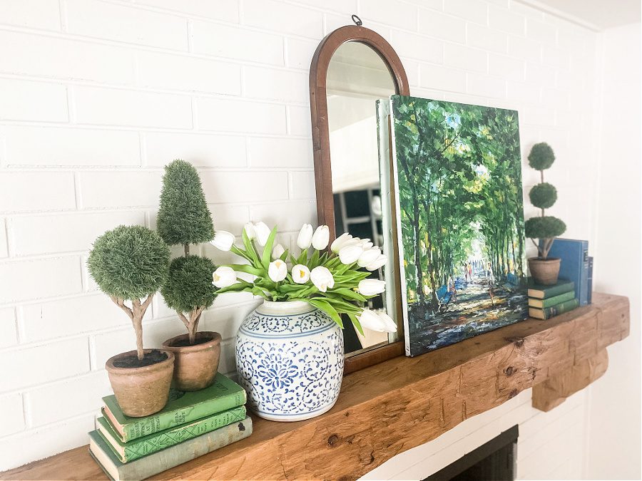 A blue and green Spring mantel with varying heights and textures.