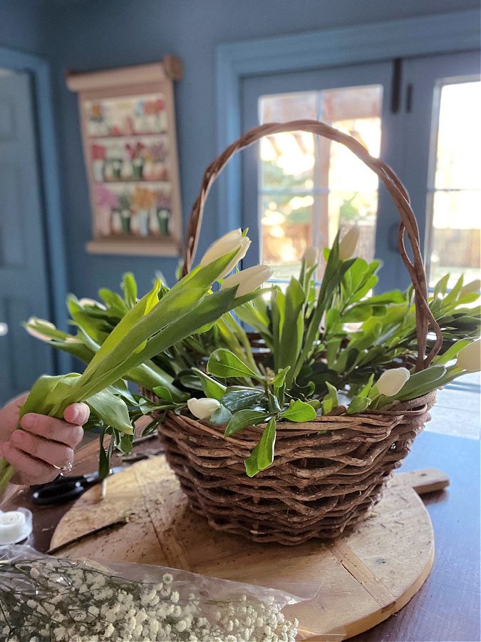 Layering white tulips an my basket arrangement.