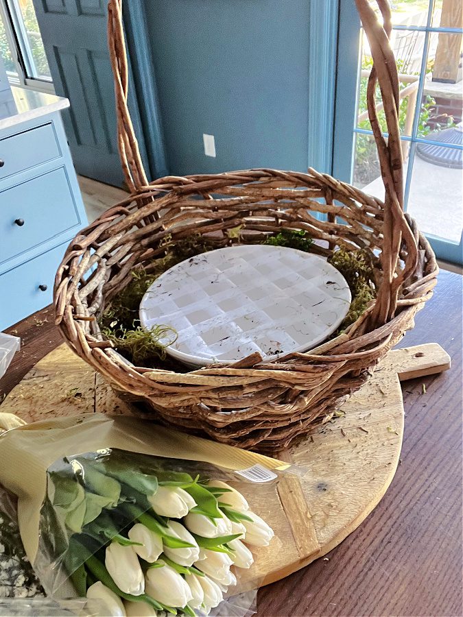 Use tape o your bowl to support your flowers.