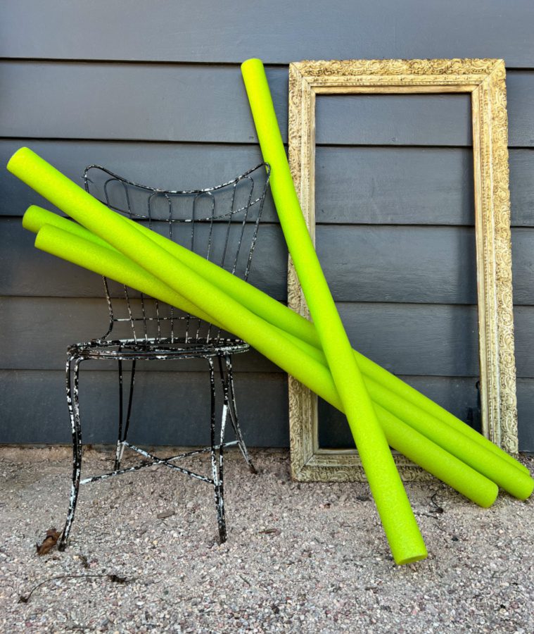 Green pool noodles and a vintage frame for an art project.