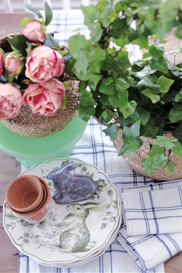 A peek at a pretty Spring vignette with sea grass baskets and pink peonies.