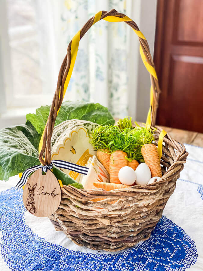 A giant sized Easter basket serves as the perfect centerpiece for this kid friendly Easter table.