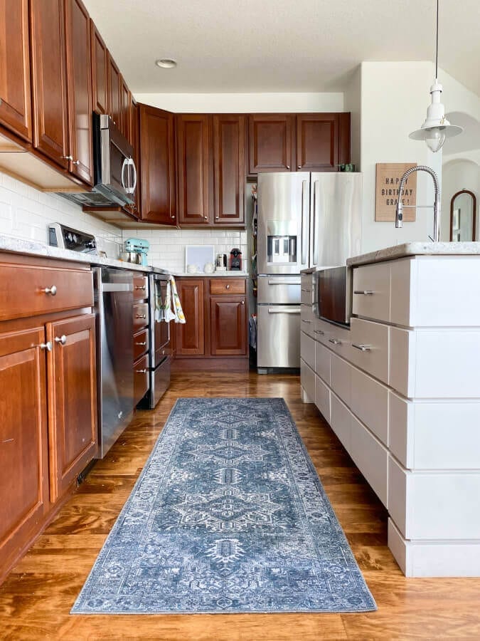 Our cherry cabinets before we decided to get them refinished in Chantilly Lace by Benjamin Moore.