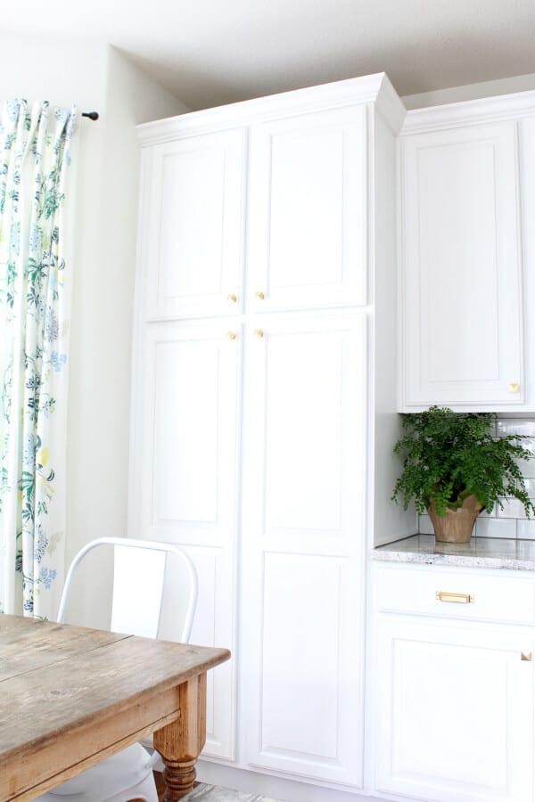 Our newly refinished cabinets looks beautiful with our new aged brass hardware from Rejuvenation.