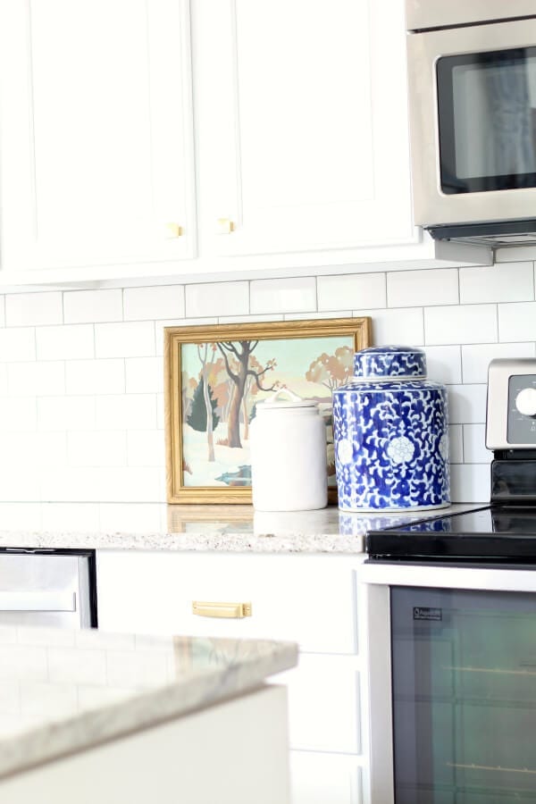 Kitchen cabinet resurfacing AFTER; white cabinets