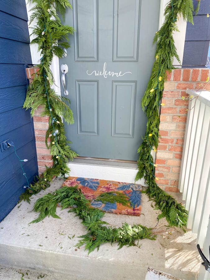 Extra garland from our door was used to make a wreath for our front window.