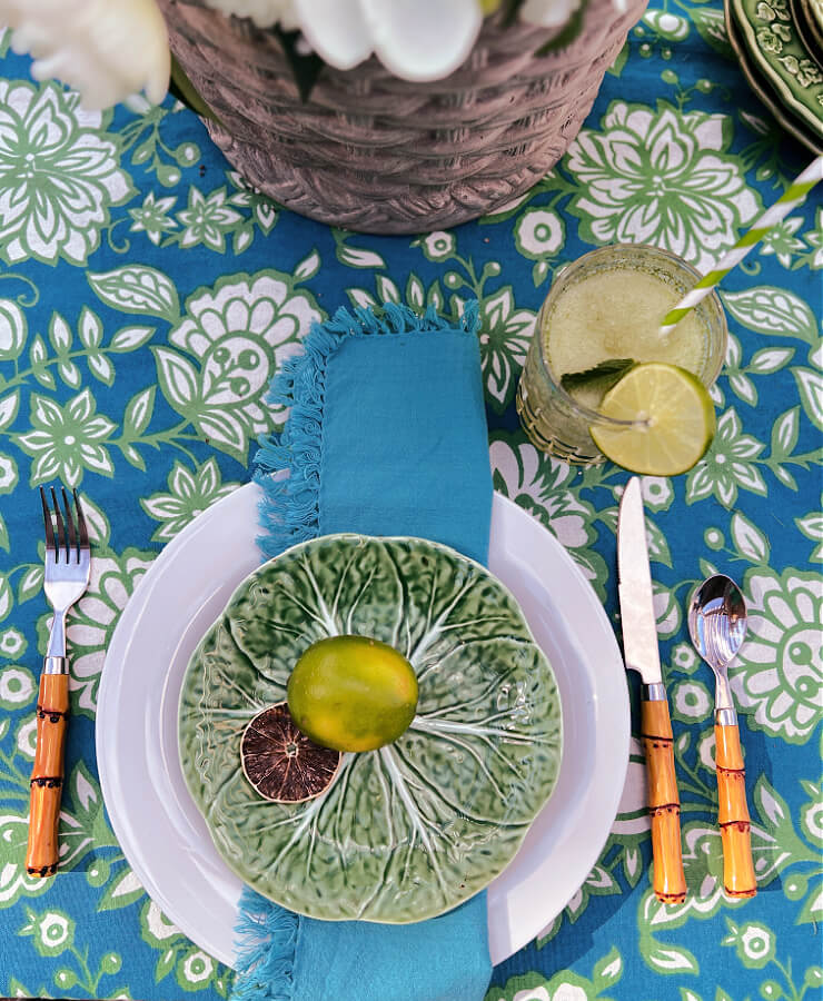 green lettuce plate with lime and faux bamboo silverware