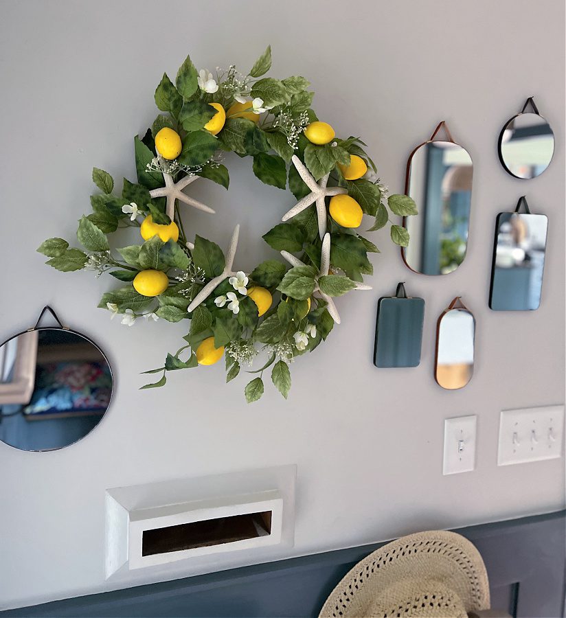 Lemon wreath with starfish and surrounded with mirrors.