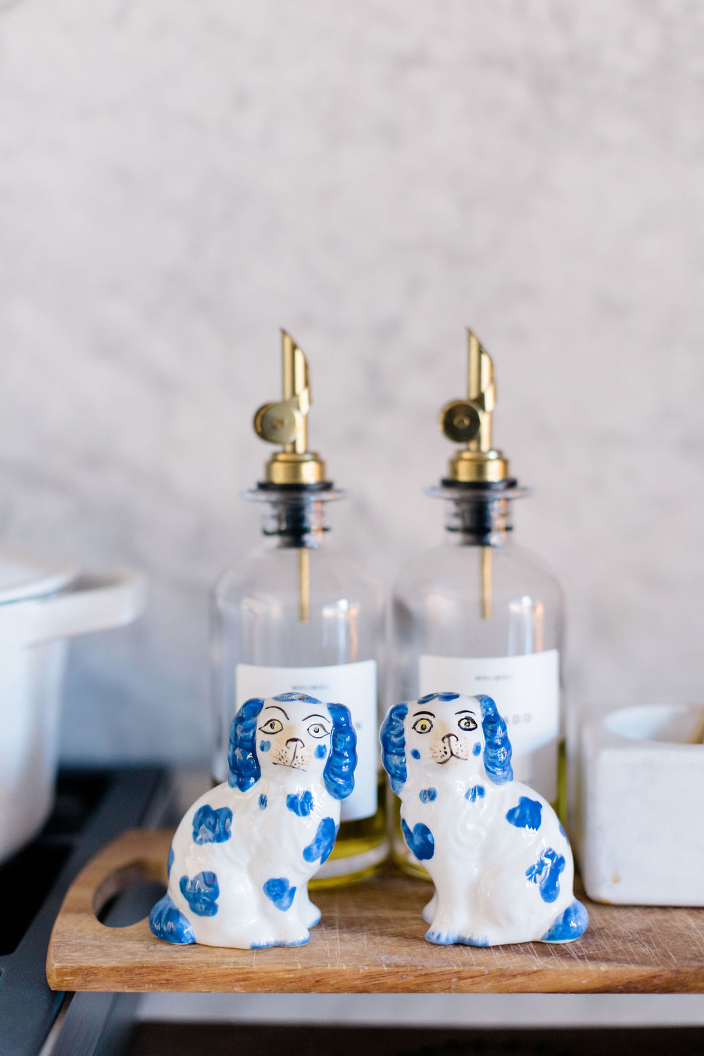 olice oil bottles and blue and white dog salt and pepper shakers