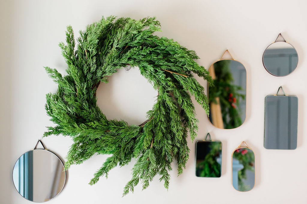 green wreath and mirrors