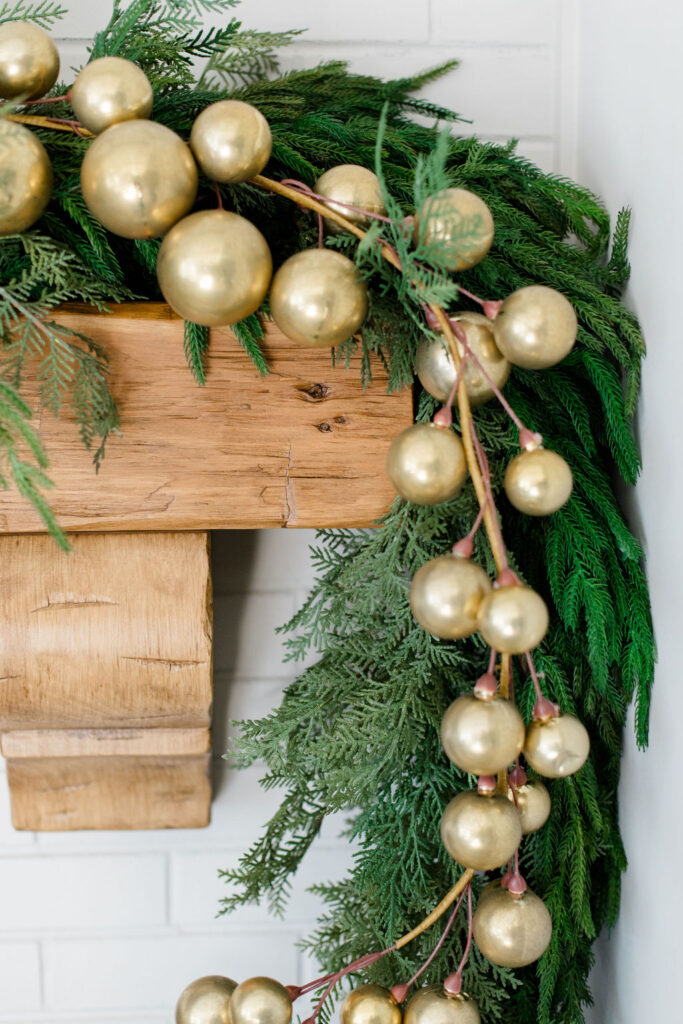 gold ball garland on our Christmas mantel