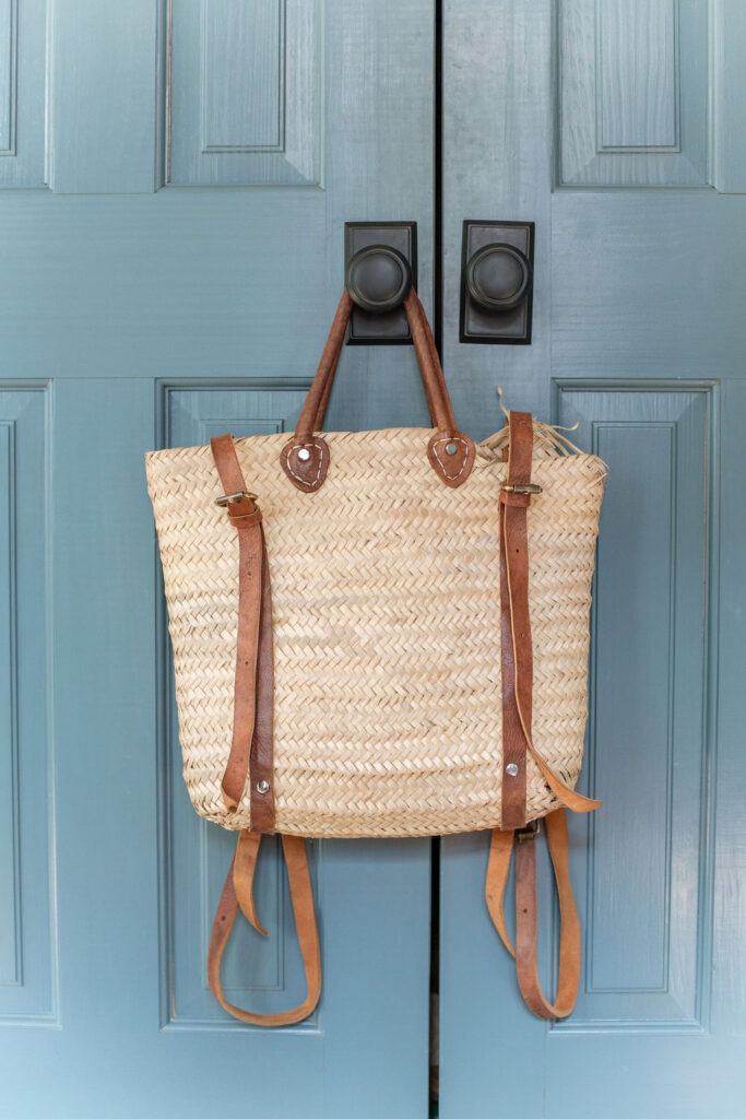 woven bag hanging on closet doors