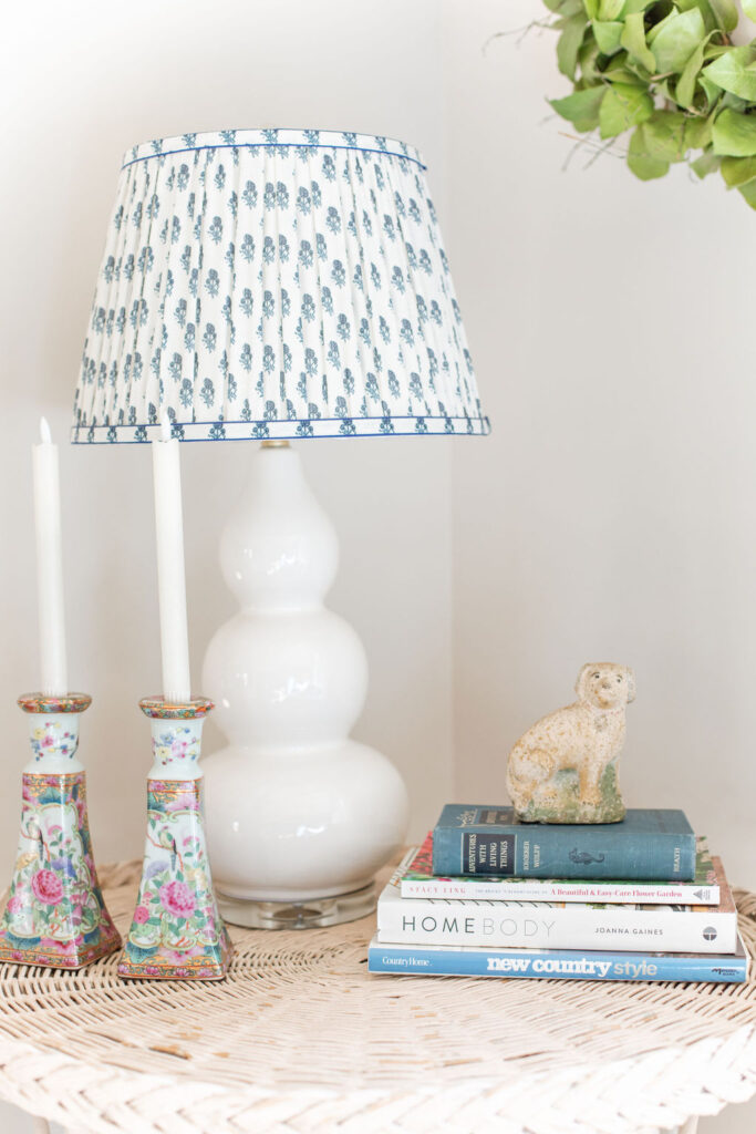 Spring vignette in family room, candles sticks, books and dog