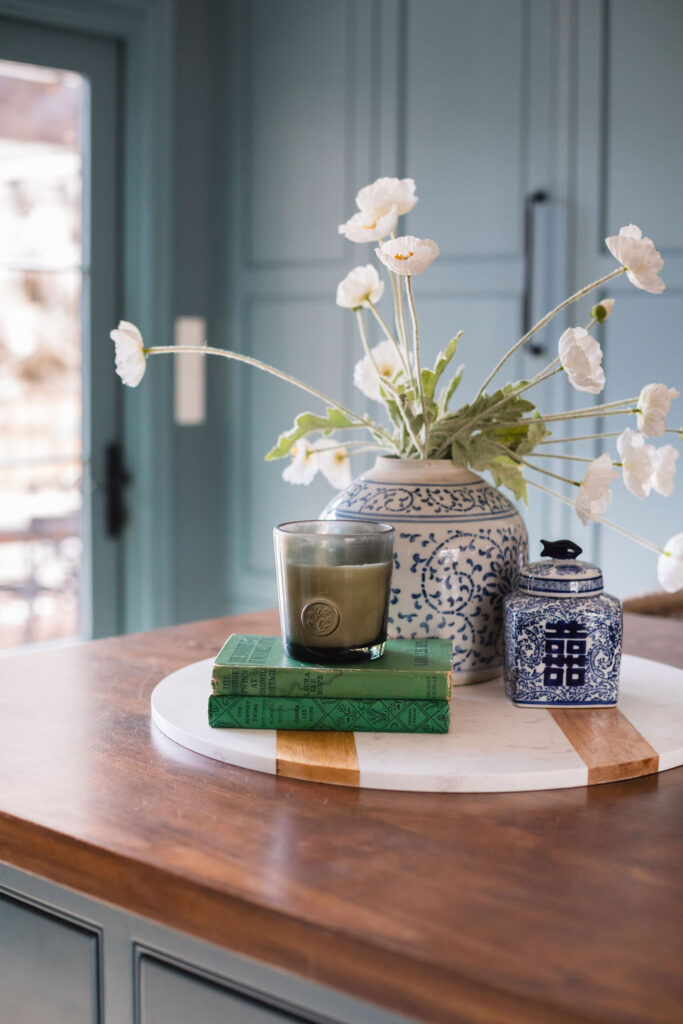 spring vignette on kitchen island with white poppies