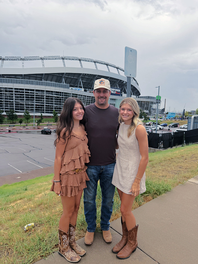 Mike and the girls at the Zach Bryan concert