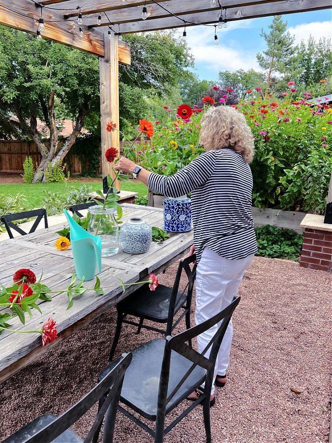 Cutting zinnias from the garden for Fall pops of color.