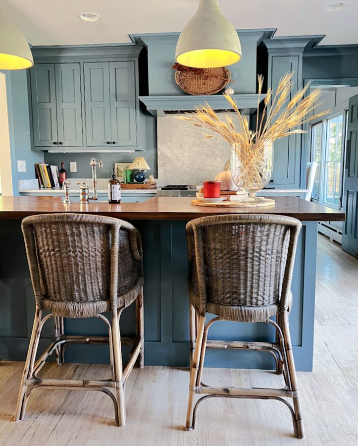 wicker chairs at island in kitchen