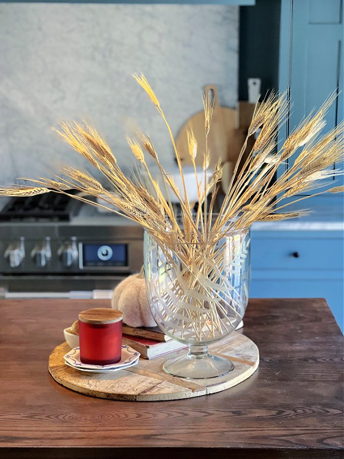 Wheat stems in glass hurricane