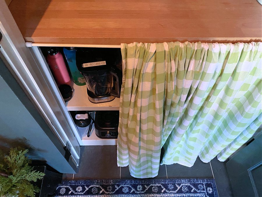 tablecloth used as curtain in pantry