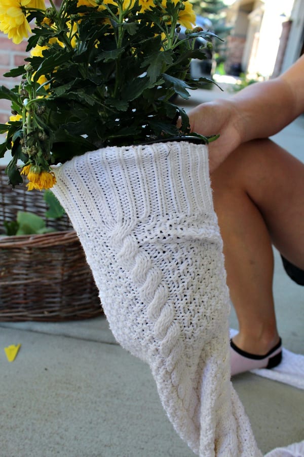 Upcycling old sweters into flower pot covers is a fun and easy diy.