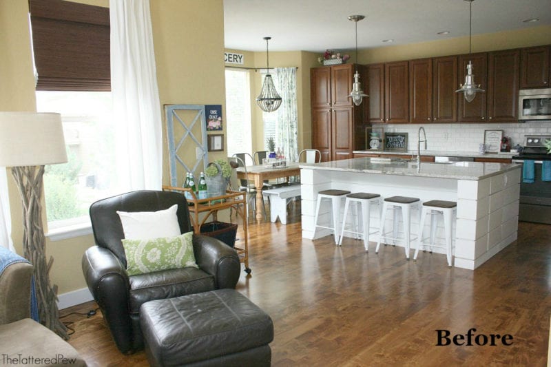 Before photo of kitchen transformation, picturing kitchen with white island and yellow walls