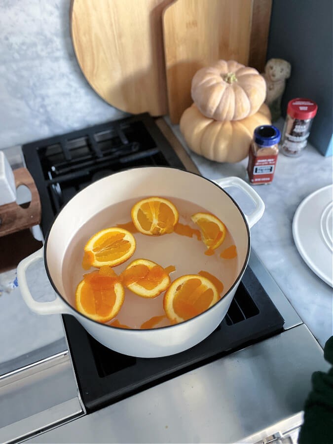 oranges in simmer pot on oven