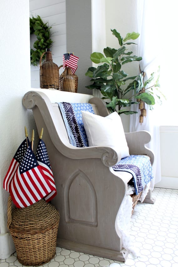 Dollar Store flags are thrifty and make any summer decor stand out! Love them next to my pew in our entry.
