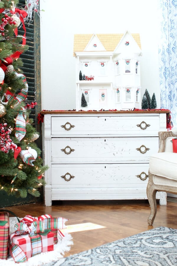 A dollhouse decorated for Christmas is sentimental and pretty!